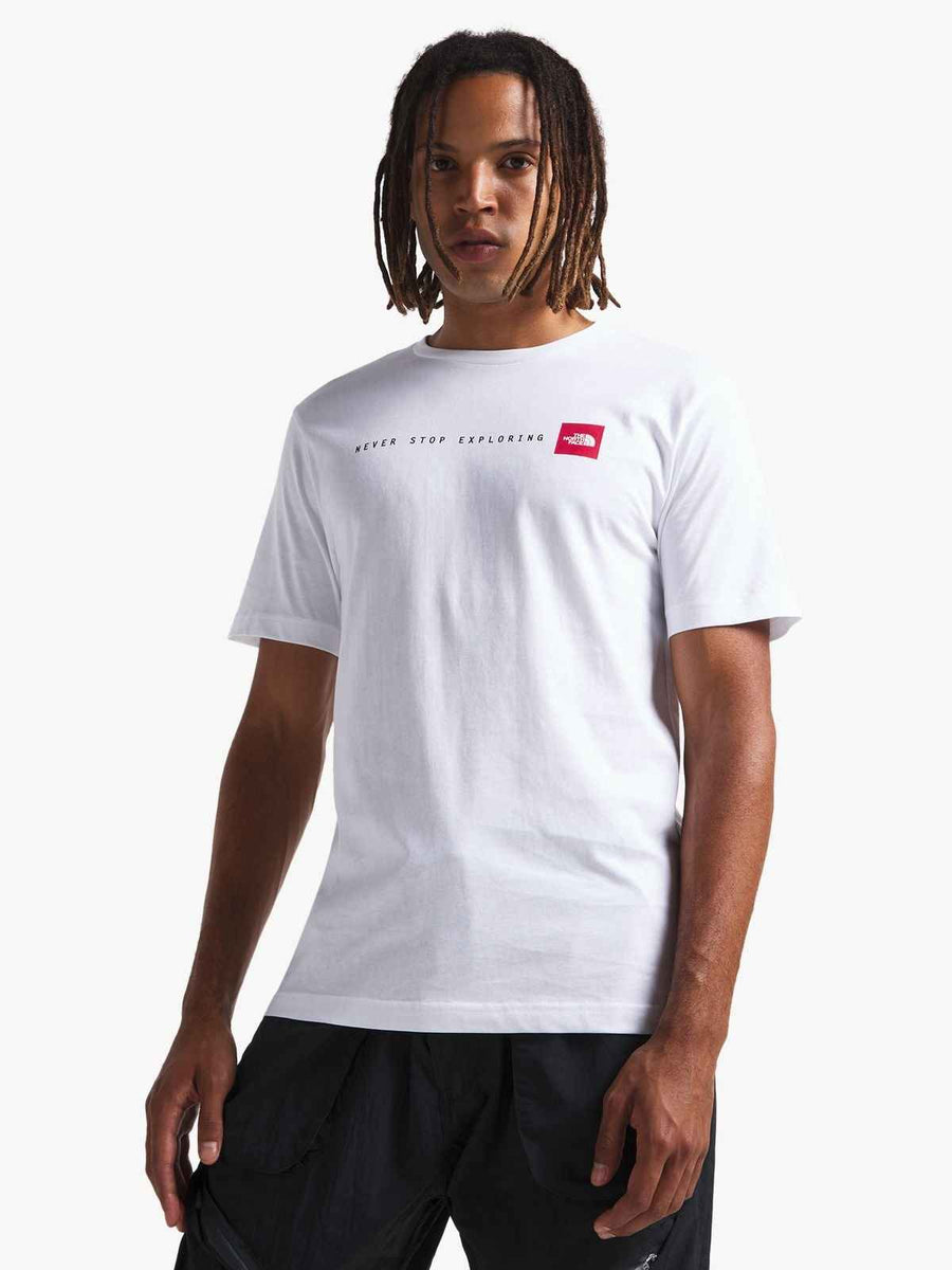 تي شيرت أبيض مطبوع عليه Never Stop Exploring من The North Face